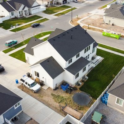 Home Aerial view of a residential neighborhood in Spanish Fork, Utah showcasing modern houses.